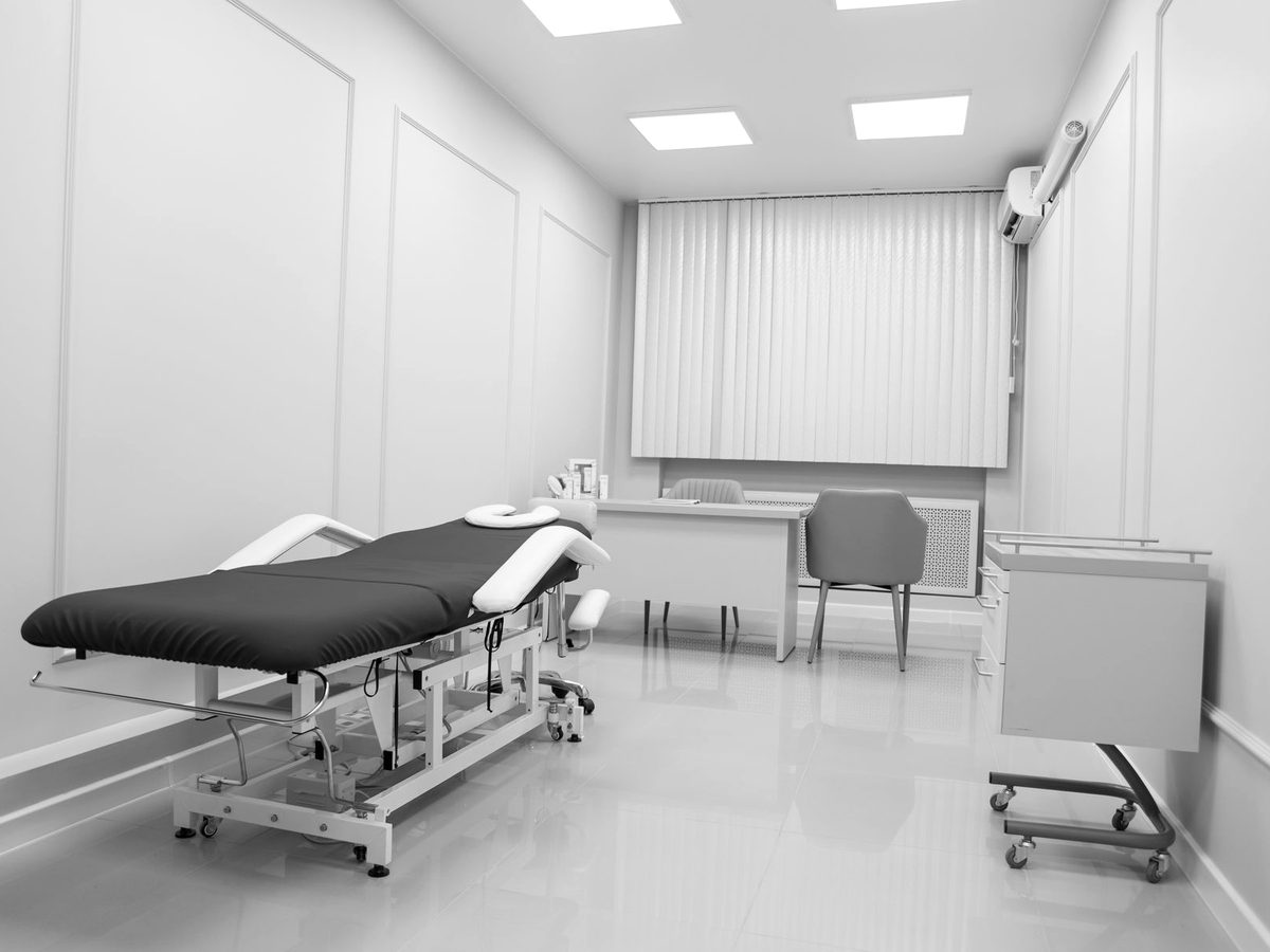 An empty, minimally furnished physiotherapy treatment room